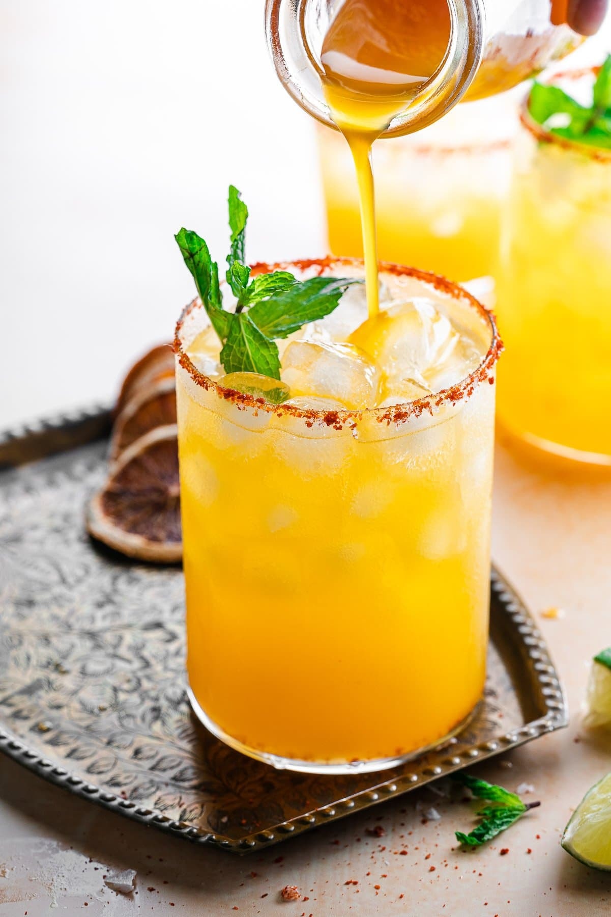 Margarita cocktail with salted rim and lime wedge